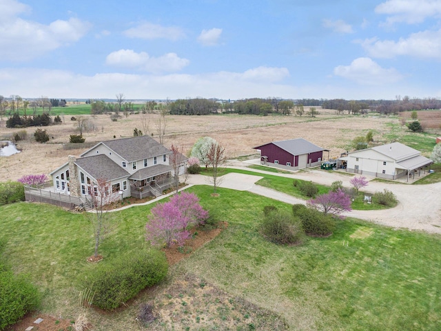 birds eye view of property with a rural view