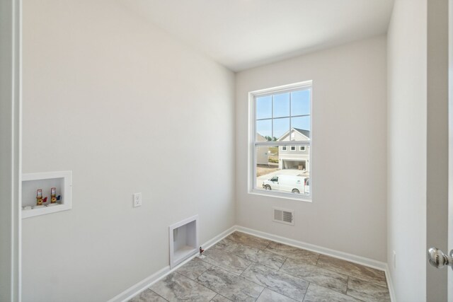 washroom with baseboards, laundry area, hookup for a washing machine, and visible vents