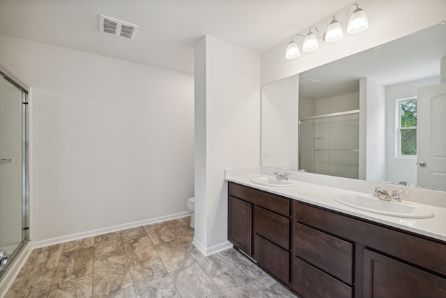 bathroom with visible vents, a sink, toilet, and a shower stall