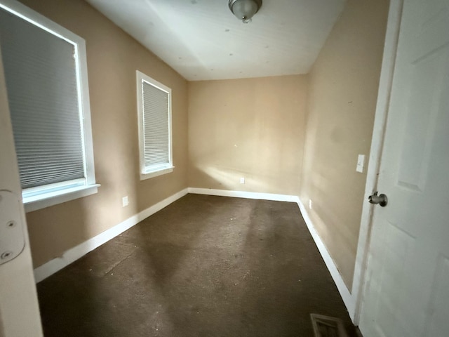11708 Broadstreet Ave, Detroit, MI 48204 - unfurnished room with visible vents, baseboards, and concrete floors