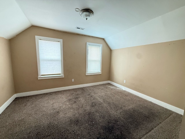 11708 Broadstreet Ave, Detroit, MI 48204 - additional living space with baseboards, lofted ceiling, visible vents, and carpet floors