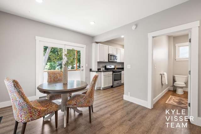 135 Houseman Ave NE, Grand Rapids, MI 49503 - dining room with plenty of natural light, wood finished floors, and recessed lighting