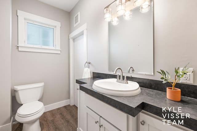 135 Houseman Ave NE, Grand Rapids, MI 49503 - half bath with vanity and wood finished floors