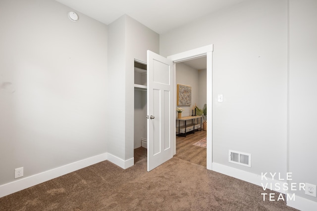 135 Houseman Ave NE, Grand Rapids, MI 49503 - carpeted empty room featuring baseboards and a smoke detector