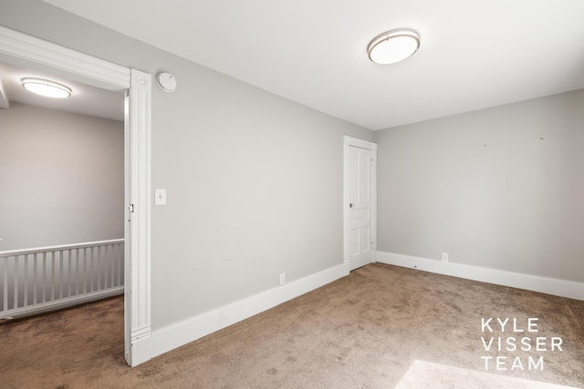135 Houseman Ave NE, Grand Rapids, MI 49503 - unfurnished room with carpet flooring and a smoke detector