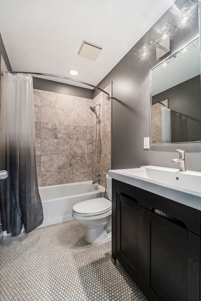 full bath featuring tile patterned floors, toilet, shower / tub combo with curtain, and vanity