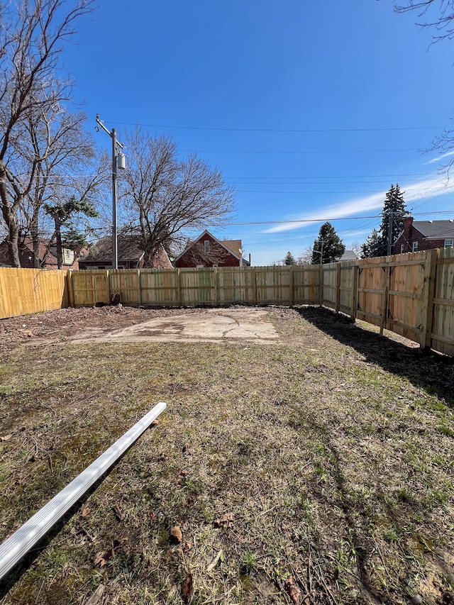 view of yard with a fenced backyard