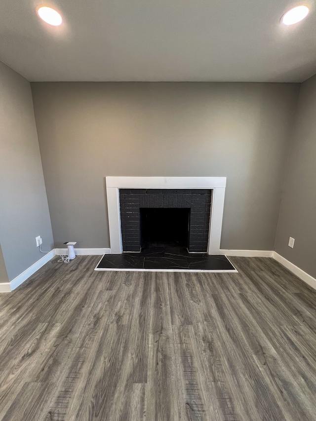 details with wood finished floors, a fireplace, baseboards, and recessed lighting