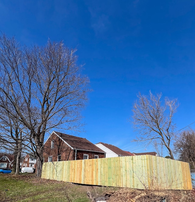 view of home's exterior with fence