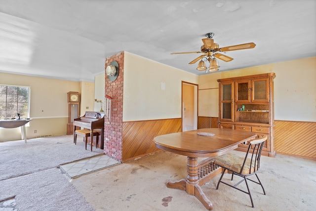 2975 Hadden Rd, Rochester, MI 48306 - carpeted dining room with wooden walls, ceiling fan, wainscoting, and visible vents