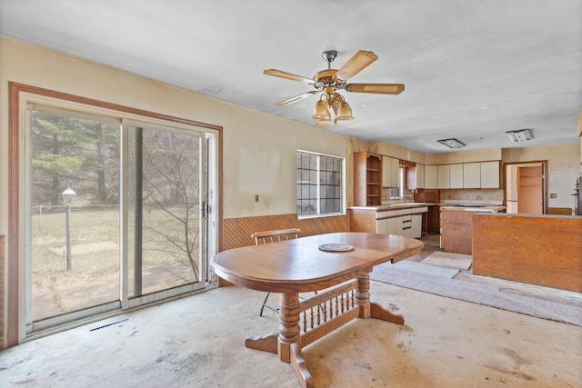 2975 Hadden Rd, Rochester, MI 48306 - dining space featuring concrete flooring, visible vents, and a ceiling fan