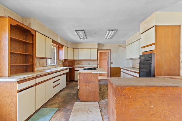 2975 Hadden Rd, Rochester, MI 48306 - kitchen featuring open shelves, oven, a sink, light countertops, and gas stovetop
