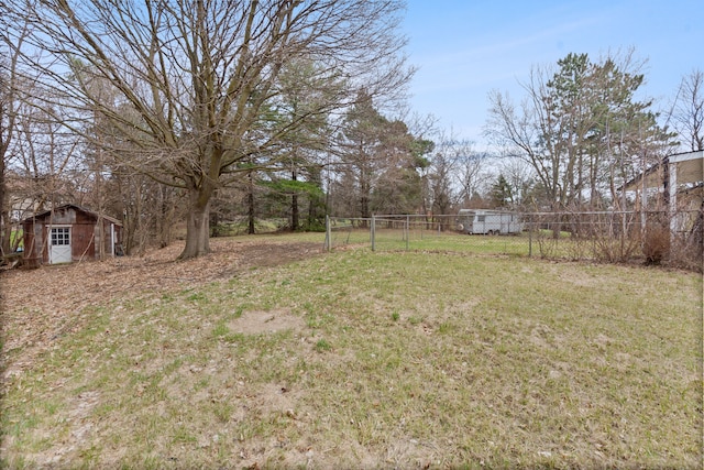 2975 Hadden Rd, Rochester, MI 48306 - view of yard featuring a storage shed, an outbuilding, and fence