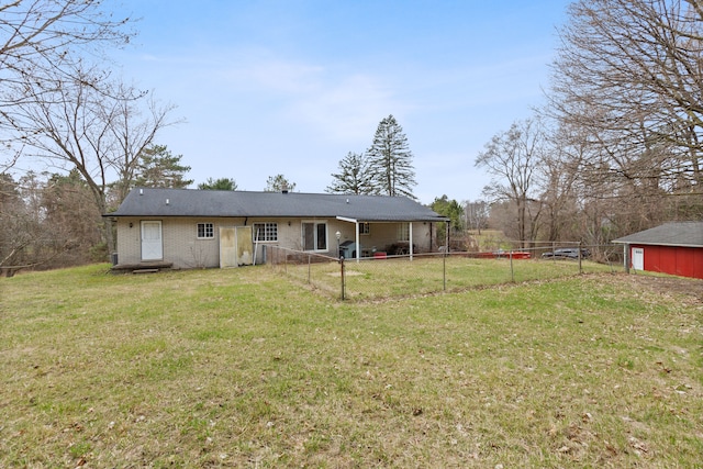 2975 Hadden Rd, Rochester, MI 48306 - back of property with a yard, brick siding, and fence