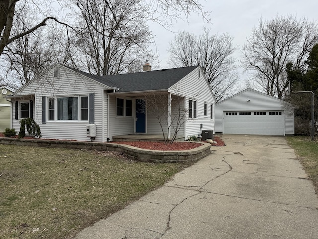 617 Cherry Ave, Big Rapids, MI 49307 - ranch-style home featuring a chimney, an outbuilding, a front lawn, central AC unit, and a garage
