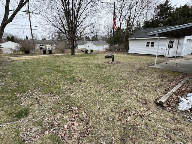 617 Cherry Ave, Big Rapids, MI 49307 - view of yard featuring a carport and a patio