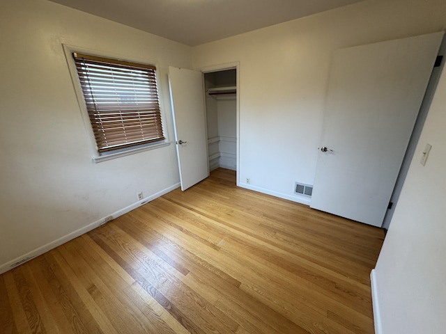 617 Cherry Ave, Big Rapids, MI 49307 - unfurnished bedroom featuring baseboards, visible vents, and light wood-style floors