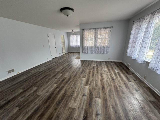 617 Cherry Ave, Big Rapids, MI 49307 - interior space featuring dark wood-style floors, baseboards, and visible vents
