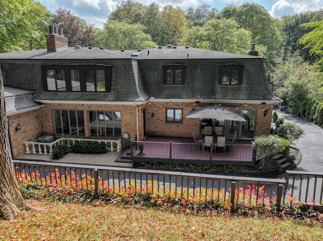 45778 Fermanagh Dr, Northville, MI 48168 - back of property with roof with shingles, a deck, and brick siding