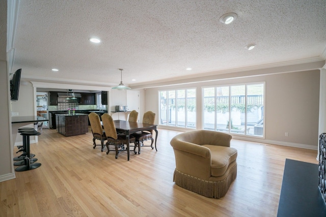 45778 Fermanagh Dr, Northville, MI 48168 - dining area with recessed lighting, light wood-style flooring, a textured ceiling, and crown molding