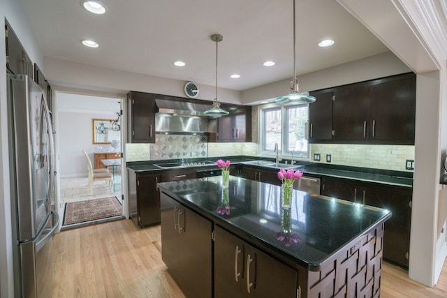 45778 Fermanagh Dr, Northville, MI 48168 - kitchen featuring a sink, appliances with stainless steel finishes, backsplash, extractor fan, and dark brown cabinets