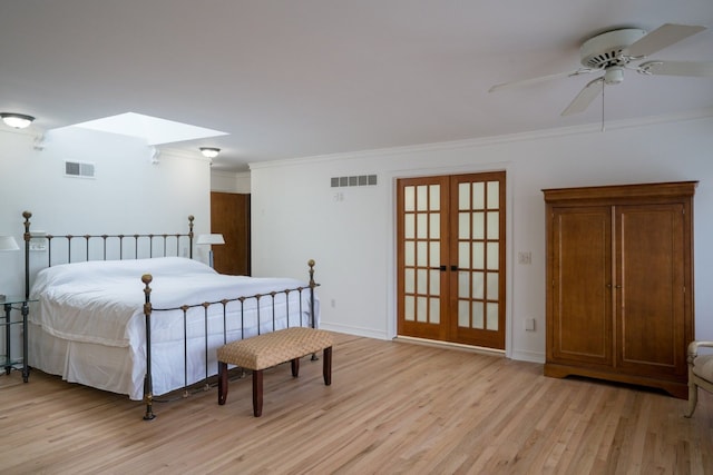 45778 Fermanagh Dr, Northville, MI 48168 - bedroom with visible vents, light wood-style floors, and a skylight