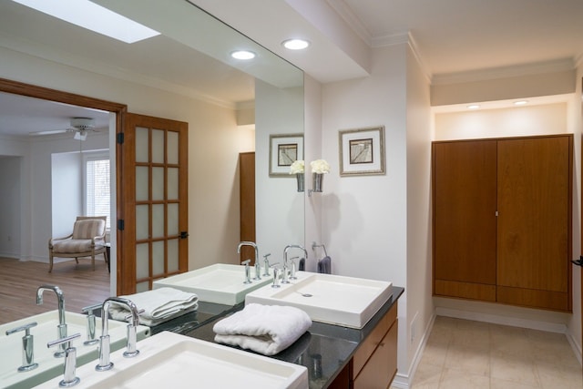 45778 Fermanagh Dr, Northville, MI 48168 - bathroom featuring baseboards, recessed lighting, crown molding, and a sink
