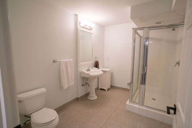 45778 Fermanagh Dr, Northville, MI 48168 - bathroom featuring tile patterned floors, baseboards, a shower stall, and toilet