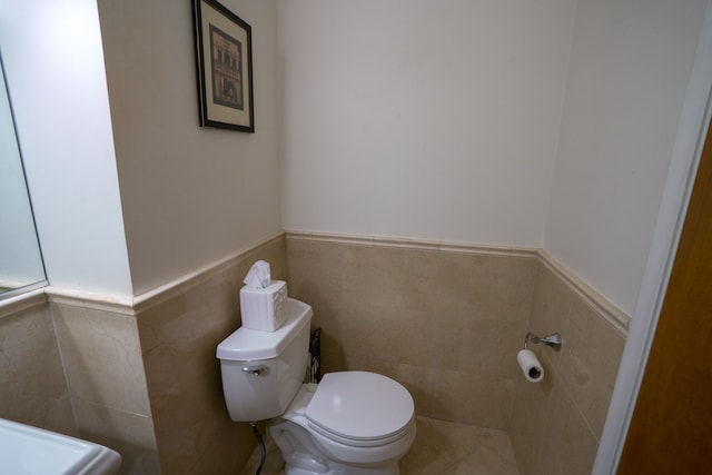 45778 Fermanagh Dr, Northville, MI 48168 - bathroom with toilet, tile walls, and wainscoting