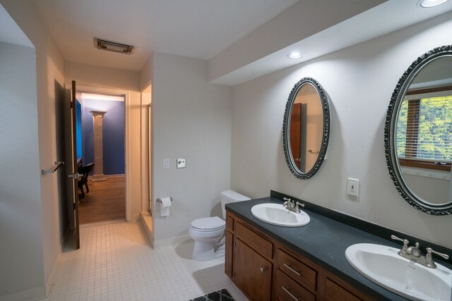 45778 Fermanagh Dr, Northville, MI 48168 - bathroom with toilet, recessed lighting, a sink, and visible vents