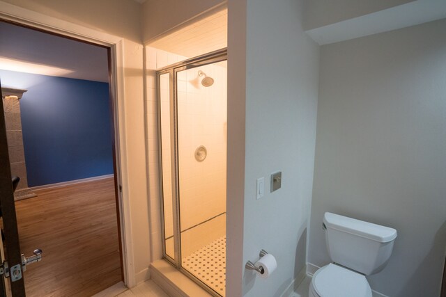 45778 Fermanagh Dr, Northville, MI 48168 - full bath featuring baseboards, a stall shower, toilet, and wood finished floors