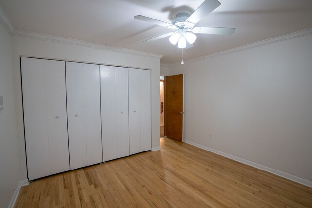 45778 Fermanagh Dr, Northville, MI 48168 - unfurnished bedroom with light wood-style floors, a closet, ornamental molding, baseboards, and a ceiling fan