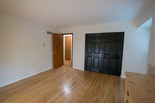 45778 Fermanagh Dr, Northville, MI 48168 - unfurnished bedroom featuring visible vents, light wood finished floors, and baseboards
