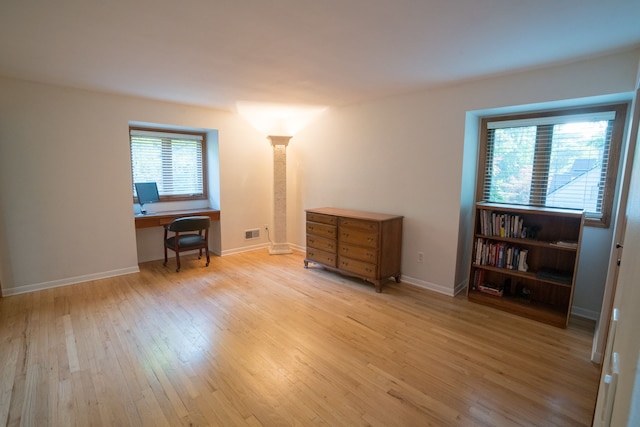 45778 Fermanagh Dr, Northville, MI 48168 - interior space with ornate columns, visible vents, light wood-style flooring, and baseboards