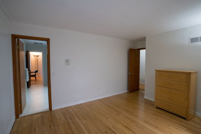 45778 Fermanagh Dr, Northville, MI 48168 - unfurnished bedroom with light wood finished floors, visible vents, and baseboards
