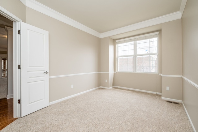 49128 Rainbow Ln S, Northville, MI 48168 - empty room with crown molding, baseboards, visible vents, and carpet floors