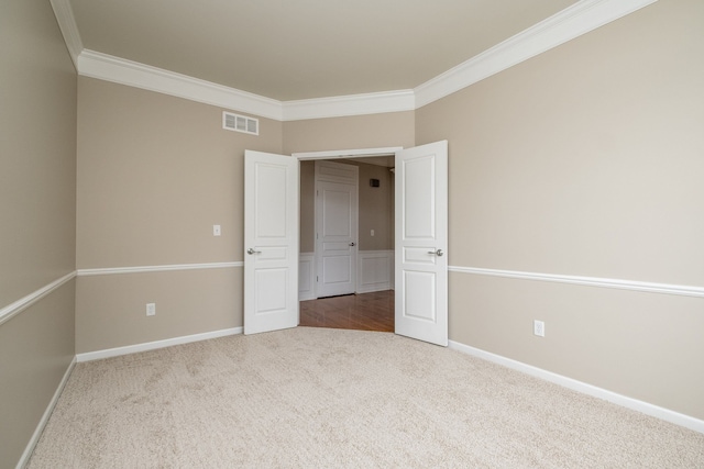 49128 Rainbow Ln S, Northville, MI 48168 - unfurnished bedroom with visible vents, baseboards, ornamental molding, and carpet floors