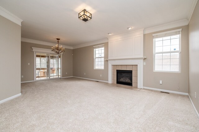 49128 Rainbow Ln S, Northville, MI 48168 - unfurnished living room featuring crown molding, visible vents, light colored carpet, and a chandelier