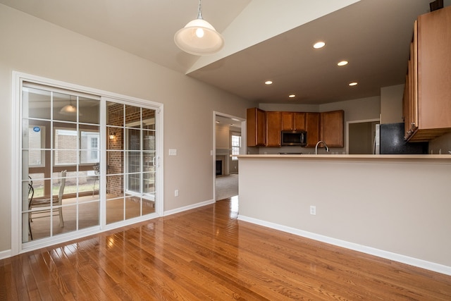 49128 Rainbow Ln S, Northville, MI 48168 - interior space featuring recessed lighting, light wood finished floors, baseboards, and a sink