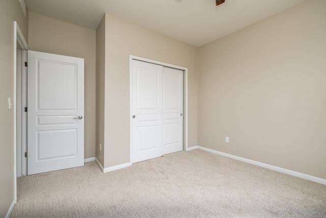 49128 Rainbow Ln S, Northville, MI 48168 - unfurnished bedroom with a closet, baseboards, and carpet floors