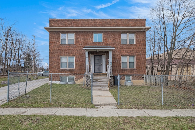view of front of property with brick siding and a fenced front yard