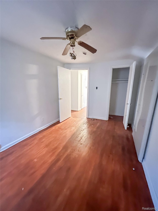 3945 Devonshire Rd, Detroit, MI 48224 - unfurnished bedroom with light wood finished floors, ceiling fan, baseboards, and a closet