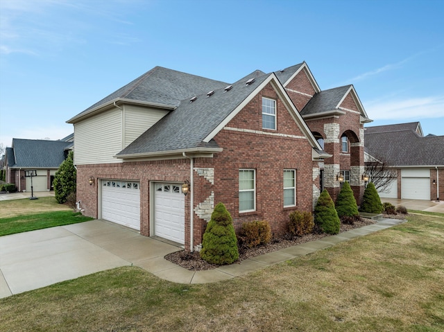 traditional-style house featuring brick siding, driveway, a garage, a front yard, and a shingled roof