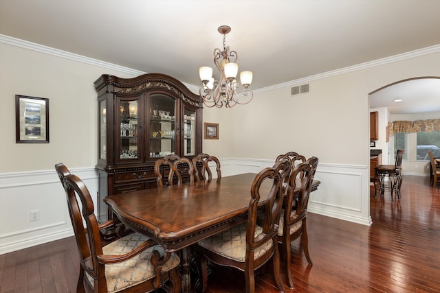 dining area featuring arched walkways, crown molding, and visible vents