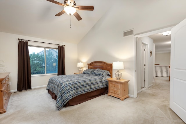 bedroom with baseboards, ceiling fan, visible vents, high vaulted ceiling, and light carpet