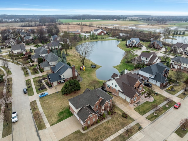 birds eye view of property featuring a water view and a residential view