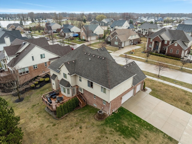 birds eye view of property with a residential view