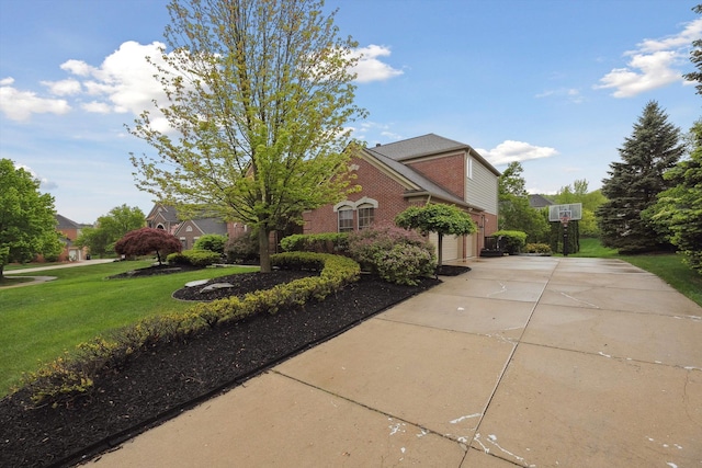 45055 Walnut Rdg, Northville, MI 48168 - view of home's exterior featuring concrete driveway, a yard, brick siding, and an attached garage