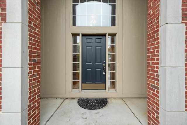 45055 Walnut Rdg, Northville, MI 48168 - view of exterior entry featuring brick siding