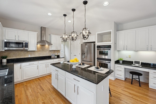 45055 Walnut Rdg, Northville, MI 48168 - kitchen with stainless steel appliances, wall chimney range hood, white cabinets, light wood finished floors, and recessed lighting